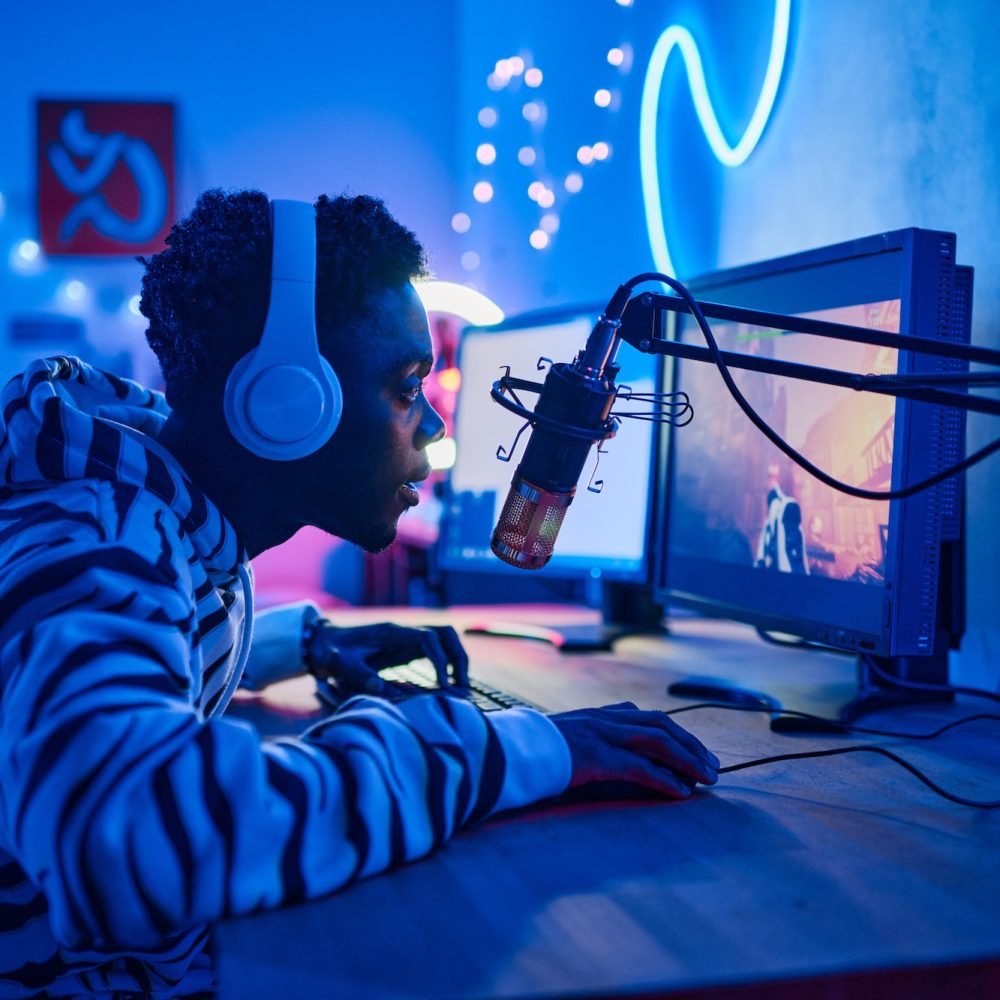 Young streamer playing online video game